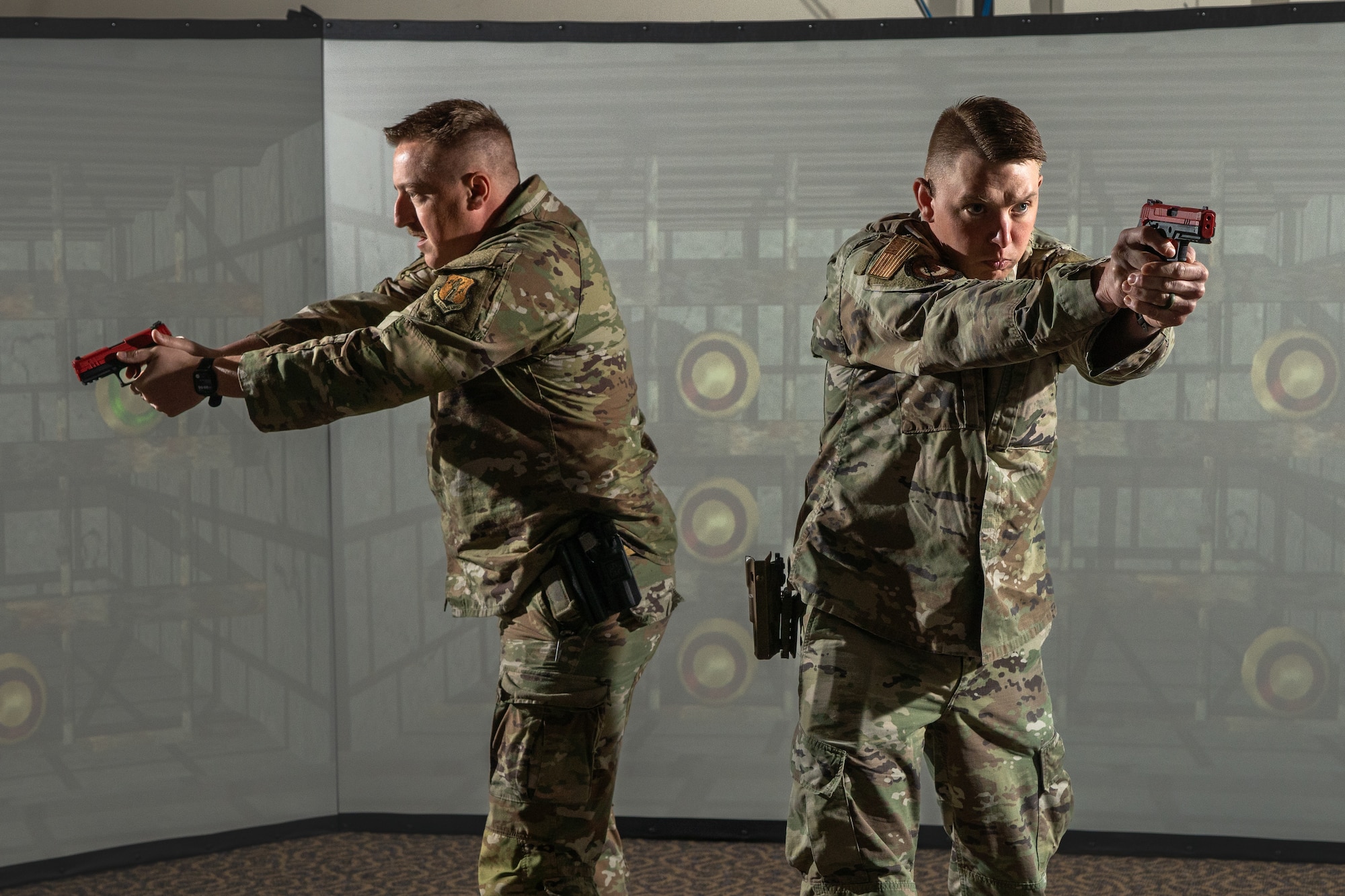 Airmen from the 155th Security Forces Squadron conduct weapons training using the Multiple Interactive Learning Objective (MILO) simulator at Joint Base Elmendorf-Richardson, Alaska, June 24, 2025.