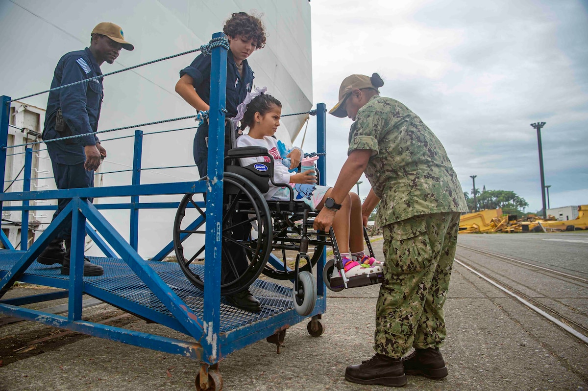 Sailors assigned to the Mercy-class hospital ship USNS Comfort (T-AH 20) assist a patient departing Comfort in Limón, Costa Rica during Continuing Promise 2025, July 28, 2025. Continuing Promise 2025 is the 16th iteration of the U.S. 4th Fleet/U.S. Naval Forces Southern Command-led mission since 2007 which aims to foster goodwill strengthen existing partnerships with partner nations and form new partnerships between host nations non-federal entities and international organizations.
