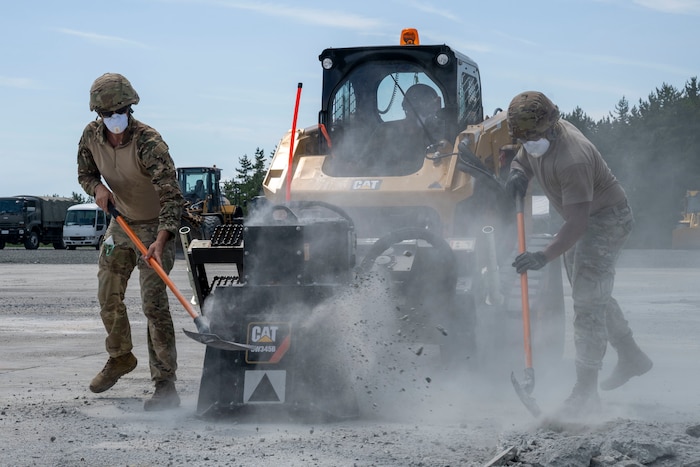 U.S. Air Force Airmen assigned to the 35th Civil Engineer Squadron clear debris from a compact track loader with a saw attachment during a rapid airfield damage repair exercise as a part of Resolute Force Pacific 2025 at Draughon Range near Misawa Air Base, Japan, July 29, 2025.