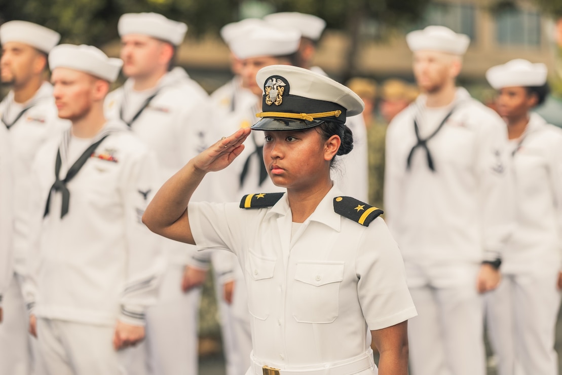 HAGATNA, Guam - Ens. Maria Sophia Minas renders a salute during the 81st Guam Liberation Day Parade.
