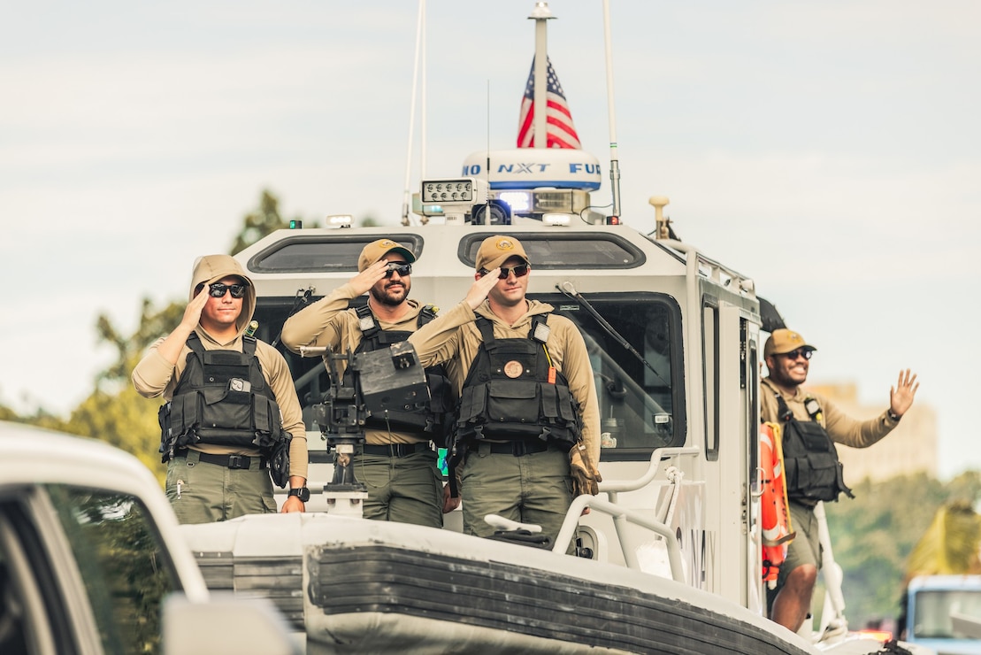 HAGATNA, Guam (July 21, 2025) - Sailors assigned to U.S. Naval Base Guam's Harbor Patrol Unit render a salute during the 81st Guam Liberation Day Parade, July 21.