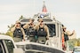 HAGATNA, Guam (July 21, 2025) - Sailors assigned to U.S. Naval Base Guam's Harbor Patrol Unit render a salute during the 81st Guam Liberation Day Parade, July 21.