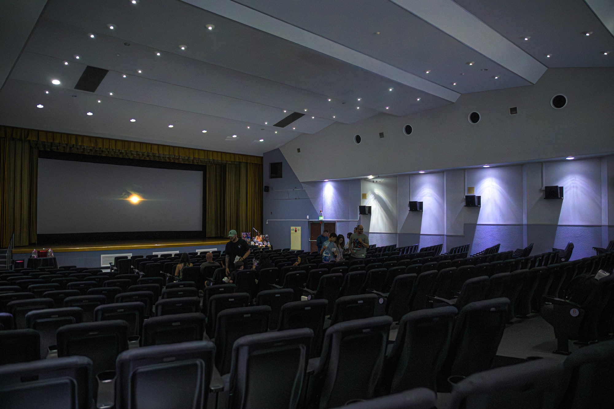 Members of Team Yokota find their seats during the first movie screening in more than a year at the base theater at Yokota Air Base, Japan, July 25, 2025. The theater offers a space that enhances morale, fosters connection, and contributes to the quality of life for Airmen, families, and the broader base community.