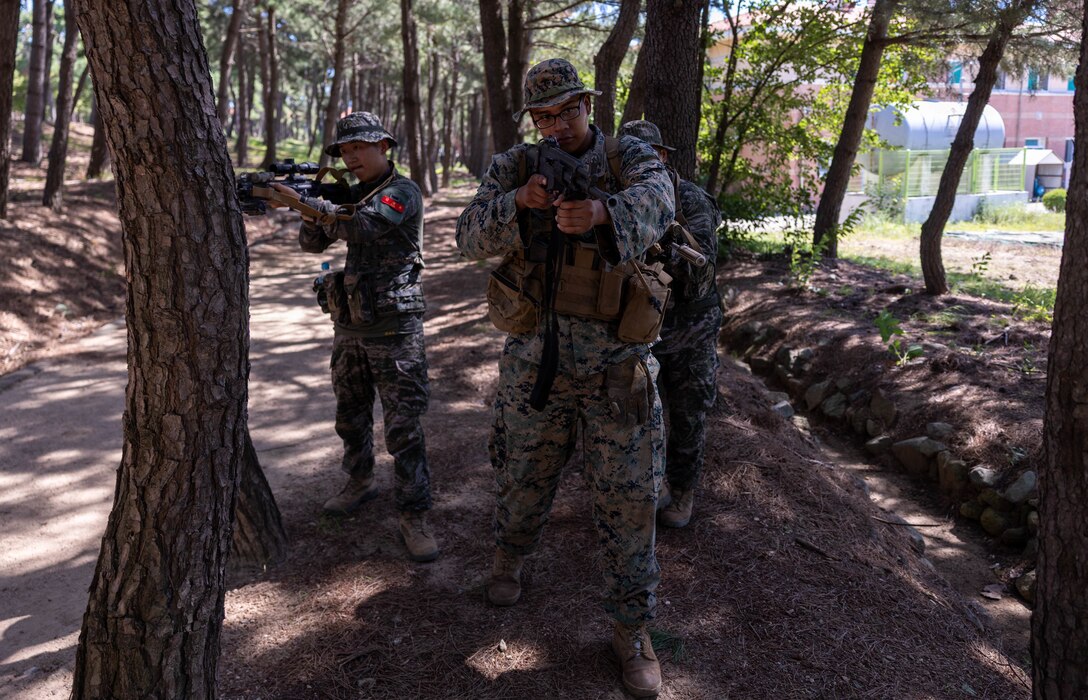 U.S. Marine Corps Cpl. Daniel RuizRomero, a rifleman with 2nd Battalion, 23rd Marines, forward deployed with 4th Marine Regiment, 3d Marine Division as part of the Unit Deployment Program, and Republic of Korea Marines with 1st Marine Division, ROK Marine Corps, maintains security during bilateral patrol training as part of the Korean Marine Exercise Program 25.2 in Pohang, South Korea, July 28, 2025. KMEP is conducted regularly between the ROK and U.S. Marine Corps to increase their combined capabilities through realistic training geared towards deterrence and maintaining peace in the Indo-Pacific. RuizRomero is a native of Georgia. (U.S. Marine Corps photo by Cpl. Kanoa Thomas)