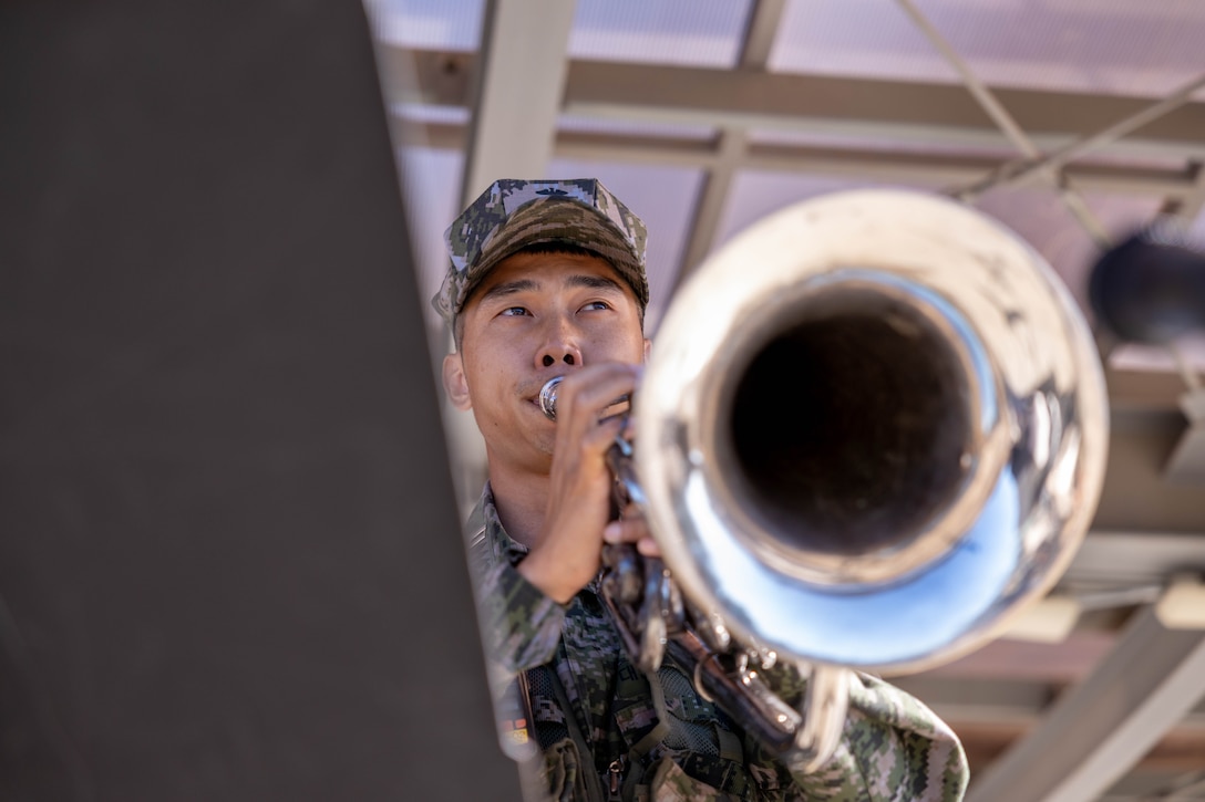 A Republic of Korea Marine with 1st Marine Division, ROK Marine Corps, plays the Marines’ Hymn as part of a formation during the Korean Marine Exercise Program 25.2 in Pohang, South Korea, July 28, 2025.  KMEP is conducted regularly between the ROK and U.S. Marine Corps to increase their combined capabilities through realistic training geared towards deterrence and maintaining peace in the Indo-Pacific. (U.S. Marine Corps photo by Cpl. Kanoa Thomas)