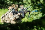 Airmen from the 155th Security Forces Squadron train on shoot, move, and communicate tactics at Joint Base Elmendorf-Richardson, Alaska, June 25, 2025. The exercise focused on developing critical combat skills, including accurate engagement, tactical movement, and effective team communication. Offsite training at JBER enhances operational realism and reinforces deployment readiness.