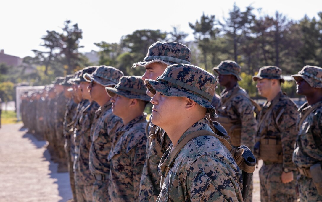 U.S. Marines 2nd Battalion, 23rd Marines, forward deployed with 4th Marine Regiment, 3d Marine Division as part of the Unit Deployment Program, and Republic of Korea Marines with 1st Marine Division, ROK Marine Corps, stand in formation before conducting bilateral patrol training as part of the Korean Marine Exercise Program 25.2 in Pohang, South Korea, July 28, 2025. KMEP is conducted regularly between the ROK and U.S. Marine Corps to increase their combined capabilities through realistic training geared towards deterrence and maintaining peace in the Indo-Pacific. (U.S. Marine Corps photo by Cpl. Kanoa Thomas)