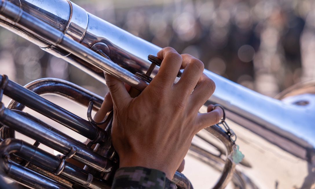 A Republic of Korea Marine with 1st Marine Division, ROK Marine Corps, plays the Marines’ Hymn as part of a formation during the Korean Marine Exercise Program 25.2 in Pohang, South Korea, July 28, 2025. KMEP is conducted regularly between the ROK and U.S. Marine Corps to increase their combined capabilities through realistic training geared towards deterrence and maintaining peace in the Indo-Pacific. (U.S. Marine Corps photo by Cpl. Kanoa Thomas)