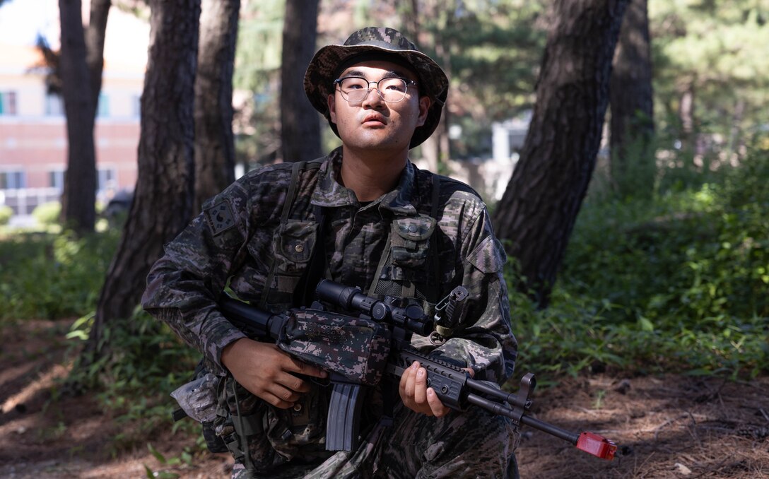 A Republic of Korea Marine with 1st Marine Division, ROK Marine Corps, patrols during the Korean Marine Exercise Program 25.2 in Pohang, South Korea, July 28, 2025. KMEP is conducted regularly between the ROK and U.S. Marine Corps to increase their combined capabilities through realistic training geared towards deterrence and maintaining peace in the Indo-Pacific. (U.S. Marine Corps photo by Cpl. Kanoa Thomas)
