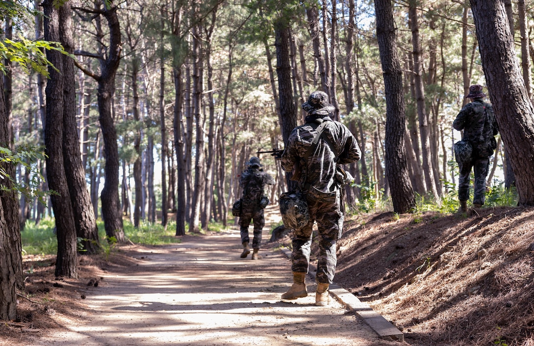 Republic of Korea Marines with 1st Marine Division, ROK Marine Corps, conduct bilateral patrol training during the Korean Marine Exercise Program 25.2 in Pohang, South Korea, July 28, 2025. KMEP is conducted regularly between the ROK and U.S. Marine Corps to increase their combined capabilities through realistic training geared towards deterrence and maintaining peace in the Indo-Pacific. (U.S. Marine Corps photo by Cpl. Kanoa Thomas)