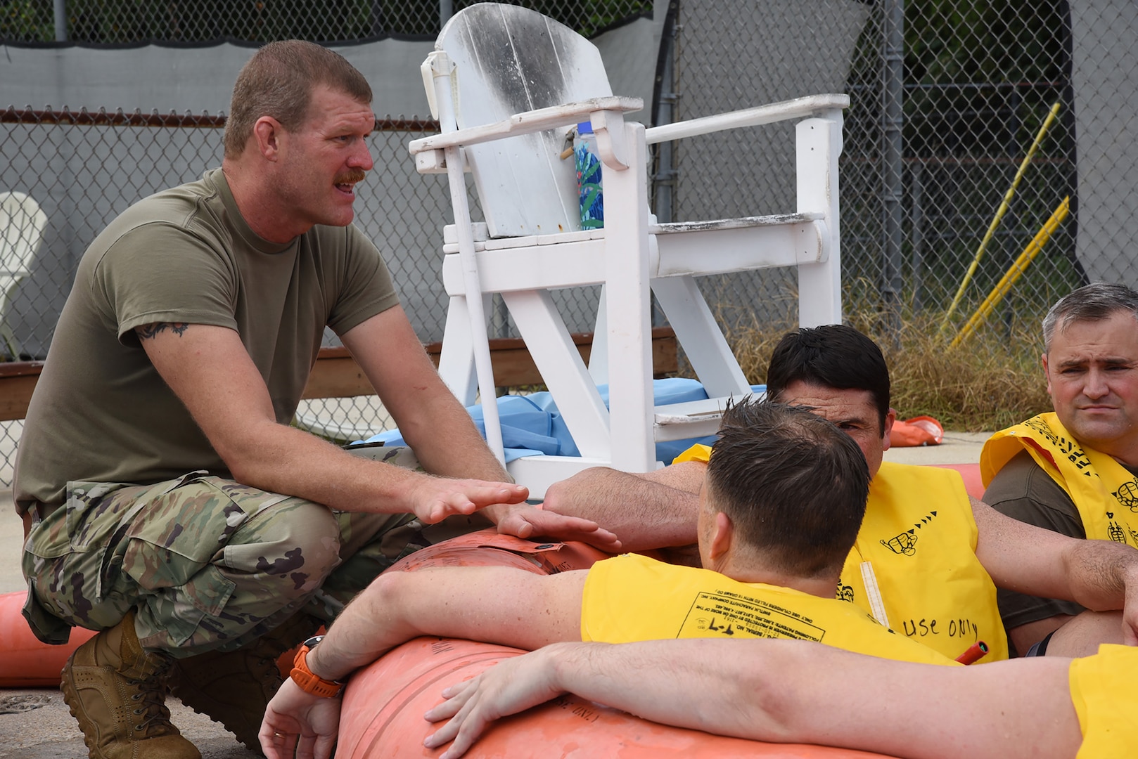 U.S. Air Force Master Sgt. Steven Harper, aircrew flight equipment technician with the 117th Operation Support Squadron, assesses the survival procedure knowledge of aircrew members inside a 20-person rescue raft during water survival training in Trussville, Alabama, August 2, 2025.