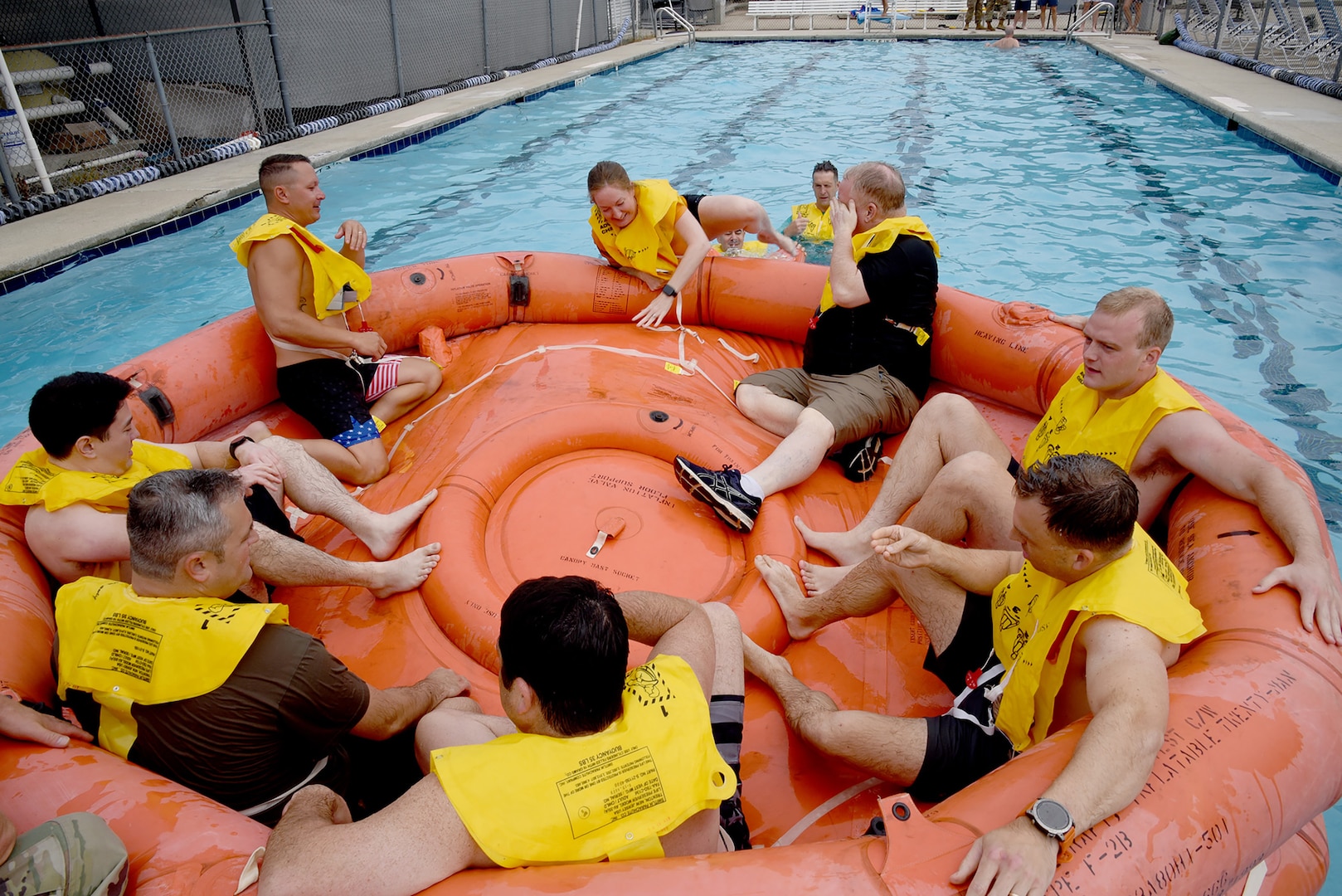 U.S. Air Force Maj. Roberta Parker, a pilot with the 106th Air Refueling Squadron, climbs into the 20-person rescue raft during water survival training in Trussville, Alabama, August 2, 2025.