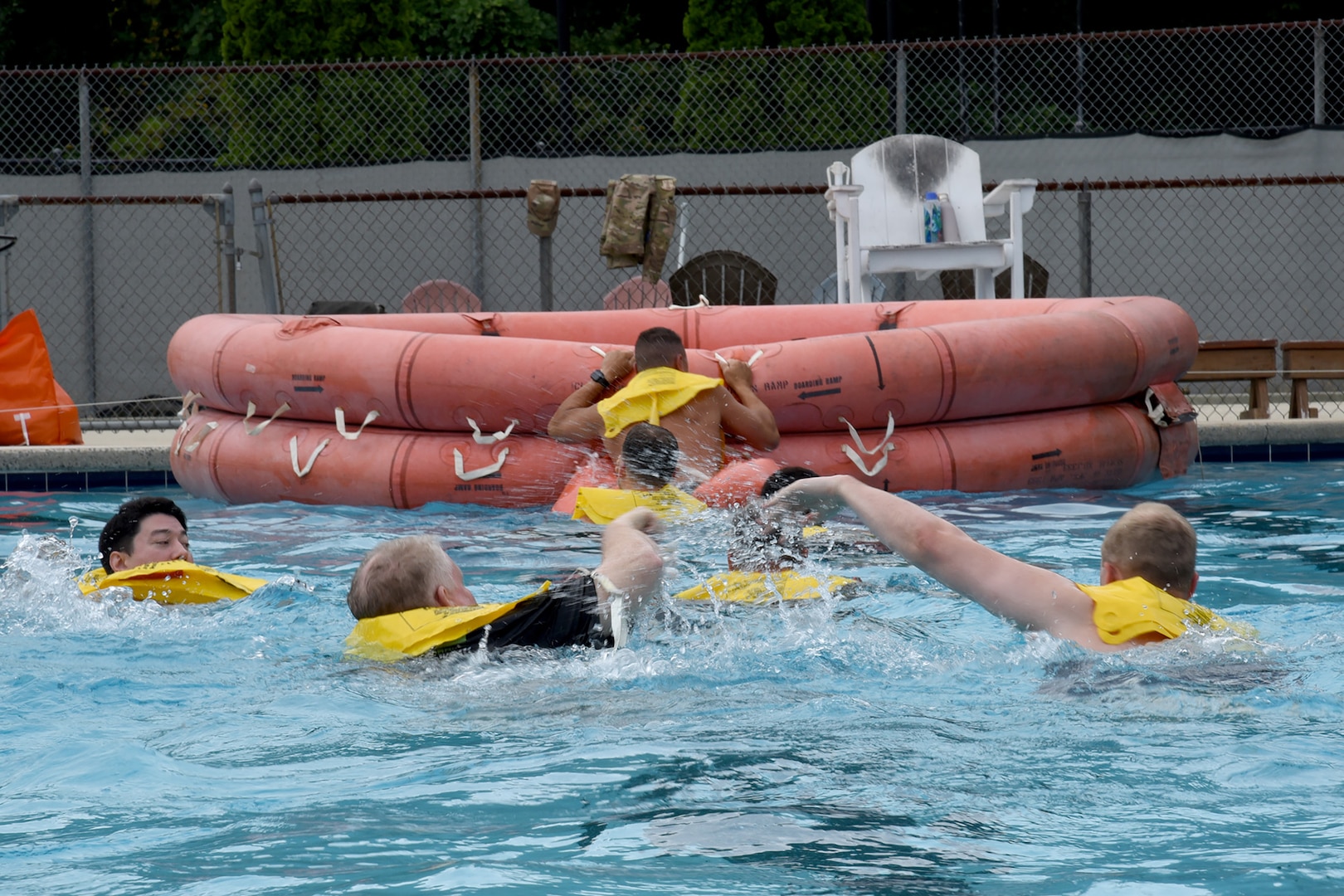Pilots and boom operators assigned to the 106th and 99th Air Refueling Squadrons swim for their rescue raft during water survival training in Trussville, Ala., August 2, 2025.