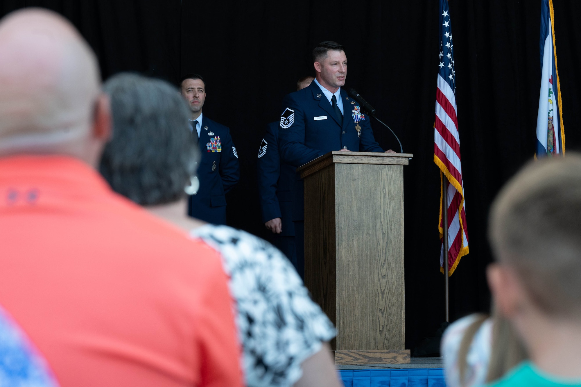 U.S. Air National Guard Master Sgt. Keith McGraw, Phoenix Raven, speaks during a Distinguished Flying Cross ceremony at the 130th Airlift Wing, Charleston, West Virginia, Aug. 3, 2025. McGraw was awarded the DFC for his distinctive heroism and extraordinary achievement while participating in aerial flight on August 30, 2021 in and over Kabul, Afghanistan in support of Operation Allies Refuge. Operation Allies Refuge was the largest non-combatant evacuation operation in American history where more than 120,000 Afghan citizens were assisted by Airmen. (U.S. Air National Guard photo by Staff Sgt. Alancea Grant)