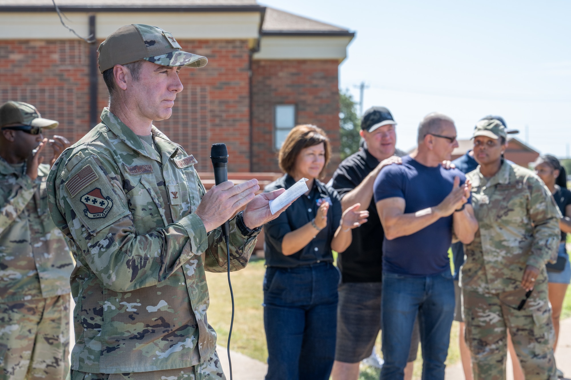 U.S. Air Force Col. Ryan Stallsworth, 7th Bomb Wing deputy commander, delivers opening remarks during the “Breaking Bread with Heroes” event at Dyess Air Force Base, Texas, July 31, 2025. The event was part of the Robert Irvine Foundation’s "Breaking Bread with Heroes" program, which aims to enhance the quality of life for service members through health, fitness, and resiliency initiatives. (U.S. Air Force photo by Airman Caleb Schellenberg)