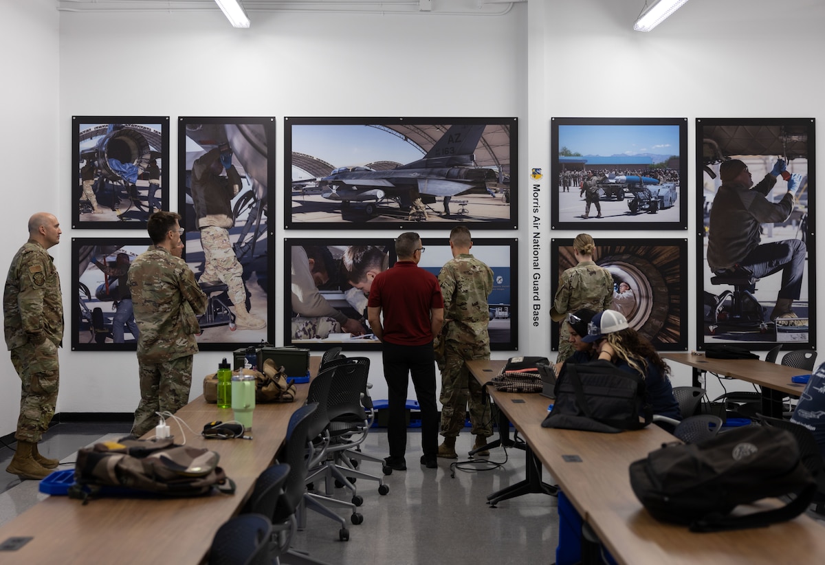 U.S. Air National Guard service members with the 162nd Mission Support Group and Pima Community College Aviation Program members gather in the newly dedicated Air National Guard classroom, in Tucson, Ariz., July 29, 2025. The collaboration included three thousand dollars in scholarships and classroom sponsorship, reinforcing the Air National Guard's investment in educational excellence and community partnerships. (U.S. Air National Guard photo by Staff Sgt. Guadalupe Beltran)