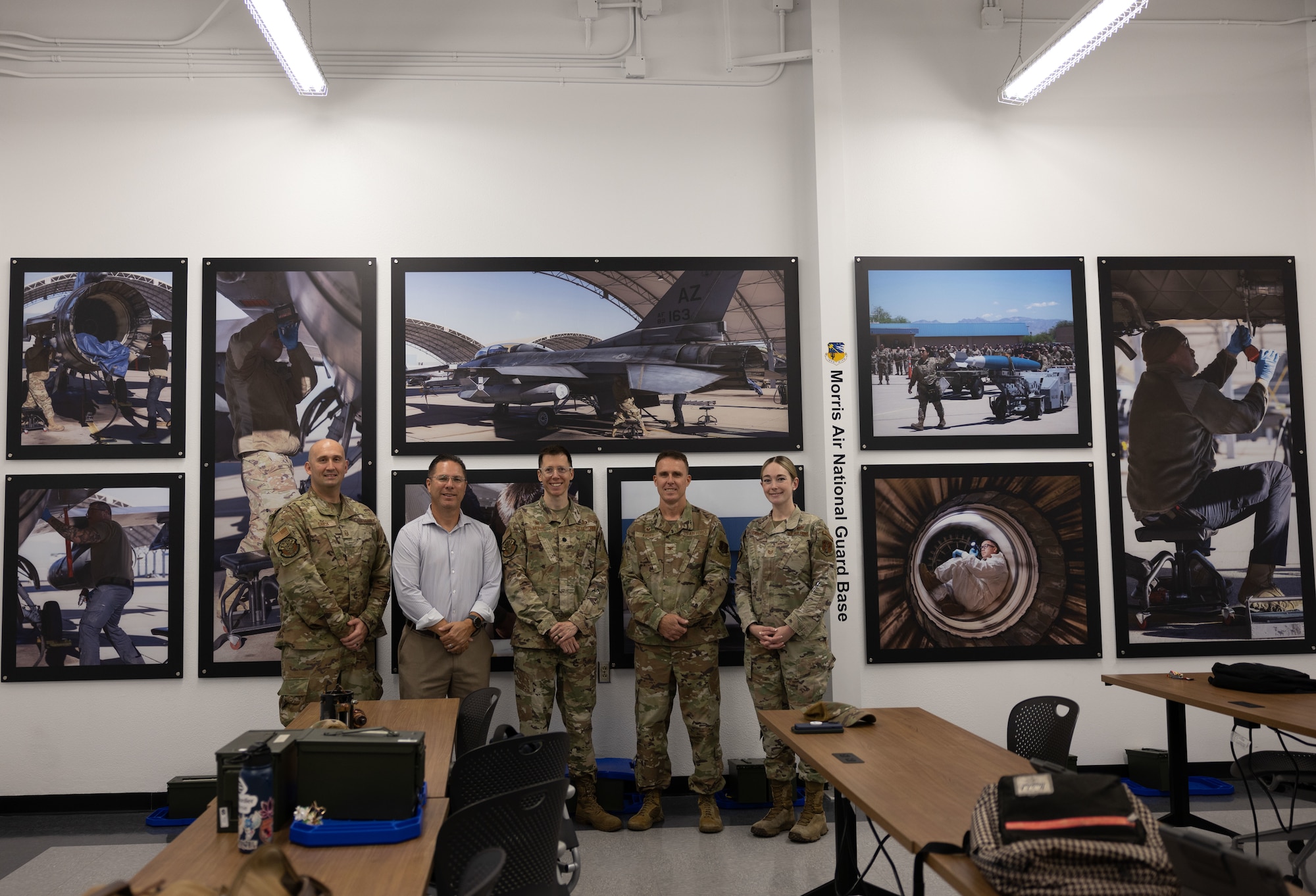 Members from the 162nd Mission Support Group gather to view the newly dedicated Air National Guard classroom at Pima Community College's Aviation Program in Tucson, Ariz., July 29, 2025. The classroom sponsorship demonstrates the 162nd Wing's commitment to developing the technical aviation workforce that supports both civilian industry and military readiness requirements. (U.S. Air National Guard photo by Staff Sgt. Guadalupe Beltran)
