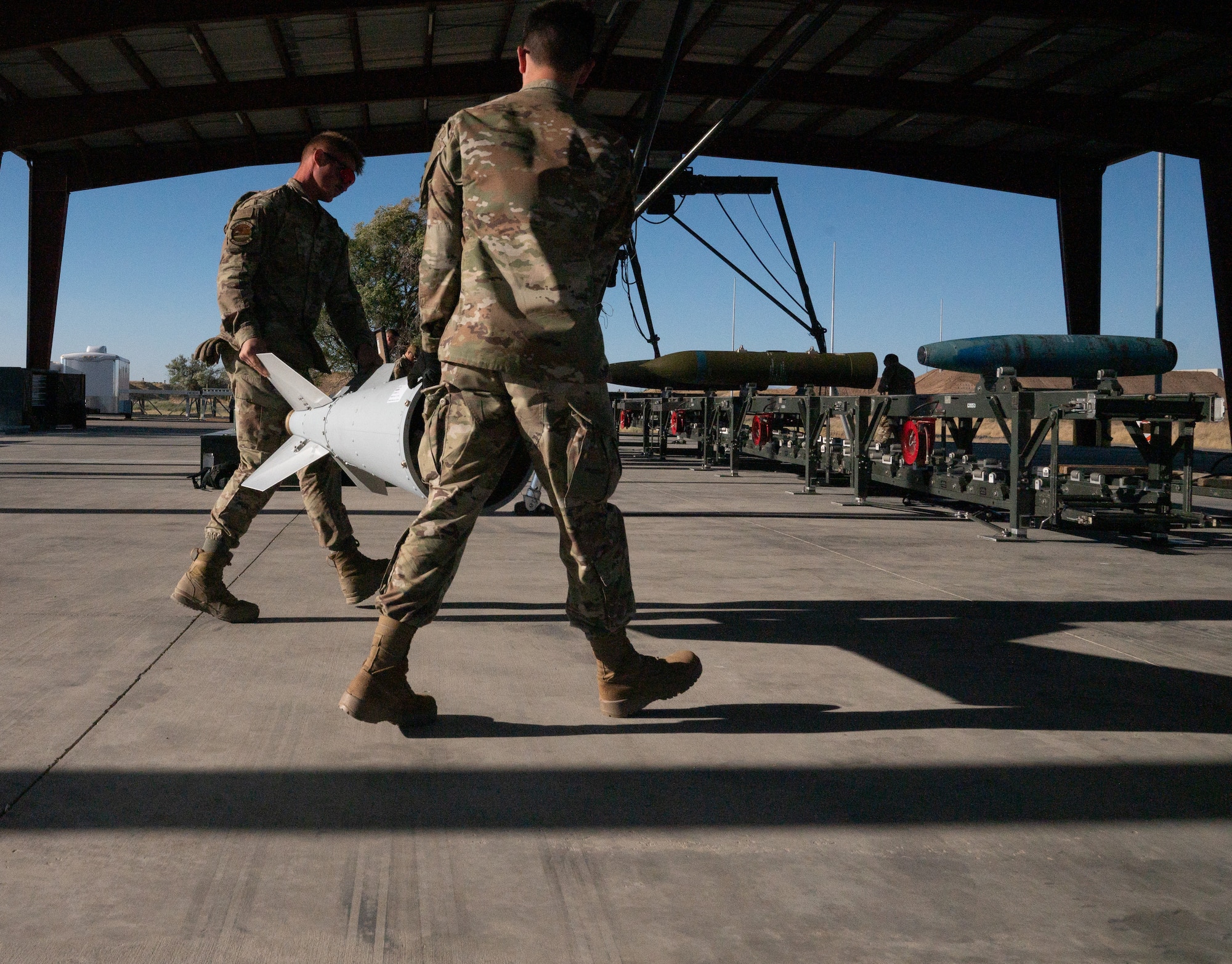 A photo of munitions Airmen building a GBU-56