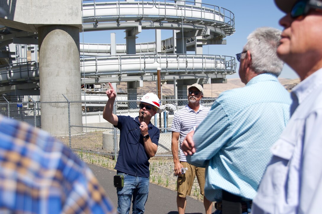 Charles Barnes, a fisheries biologist with the U.S. Army Corps of Engineers Walla Walla District, speaks with members of the Family Farm Alliance during a tour of the Lower Granite Lock and Dam, July 17, 2025.
Lower Granite Lock and Dam, located on the Snake River in southeastern Washington, includes a dam, navigation lock, powerhouse, fish ladder, and associated facilities. The project provides hydropower, navigation, flood risk management, fish and wildlife habitat, recreation, and incidental irrigation. The dam spans approximately 3,200 feet and has an effective height of 100 feet. It is a concrete gravity structure with an earthfill right abutment embankment.