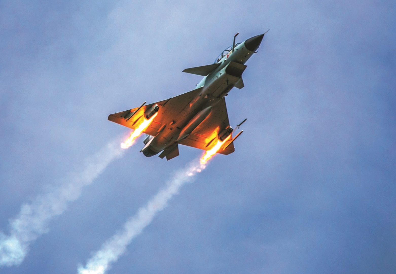 People’s Liberation Army Air Force J-10 fighter jet under Southern Theater Command fires rockets at simulated ground targets during live-fire flight training exercise.