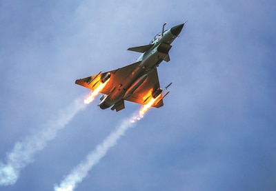 People’s Liberation Army Air Force J-10 fighter jet under Southern Theater Command fires rockets at simulated ground targets during live-fire flight training exercise.