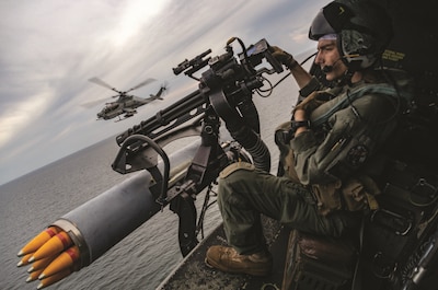 Marine Corps Sergeant Raylin Carter, aerial observer with Marine Medium Tiltrotor Squadron 362 (Reinforced), 13th Marine Expeditionary Unit, participates in flight operations with AH-1Z Viper pilots during transit of Malacca Strait.