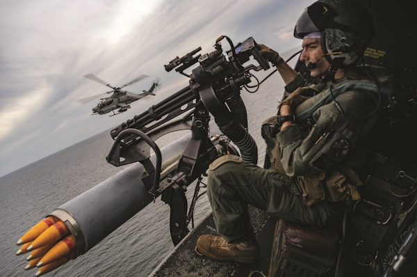 Marine Corps Sergeant Raylin Carter, aerial observer with Marine Medium Tiltrotor Squadron 362 (Reinforced), 13th Marine Expeditionary Unit, participates in flight operations with AH-1Z Viper pilots during transit of Malacca Strait.