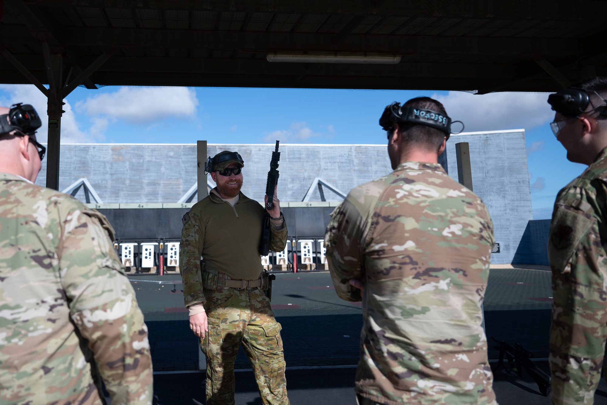 RAAF member teaches defenders on the operation of the EF-88 Austeyr