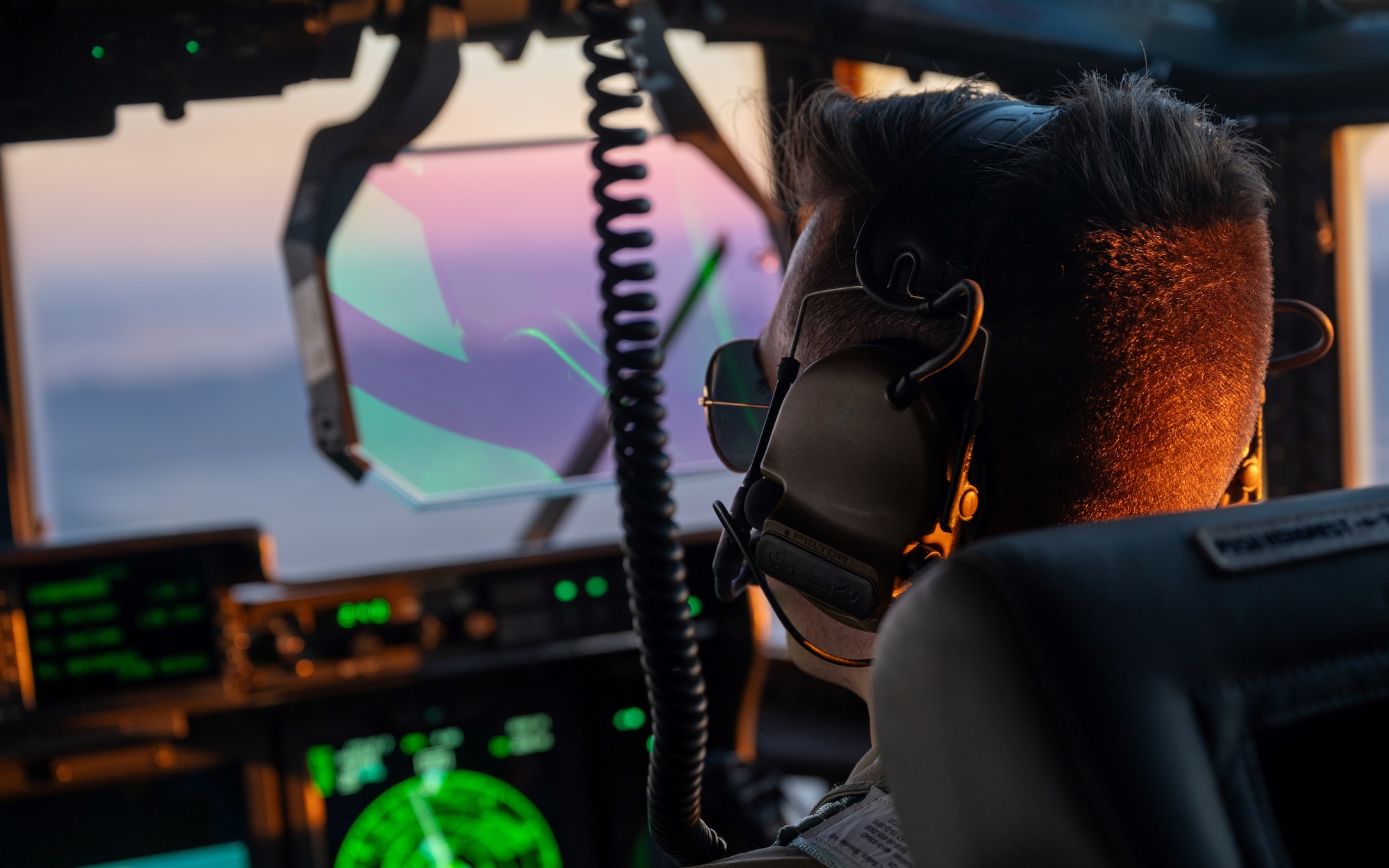 A U.S. Air Force Air Commando assigned to AFSOC operates a MC-130J Commando II aircraft during Emerald Warrior 25.2.
