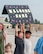 Two children hold up a sign saying "Welcome Home."