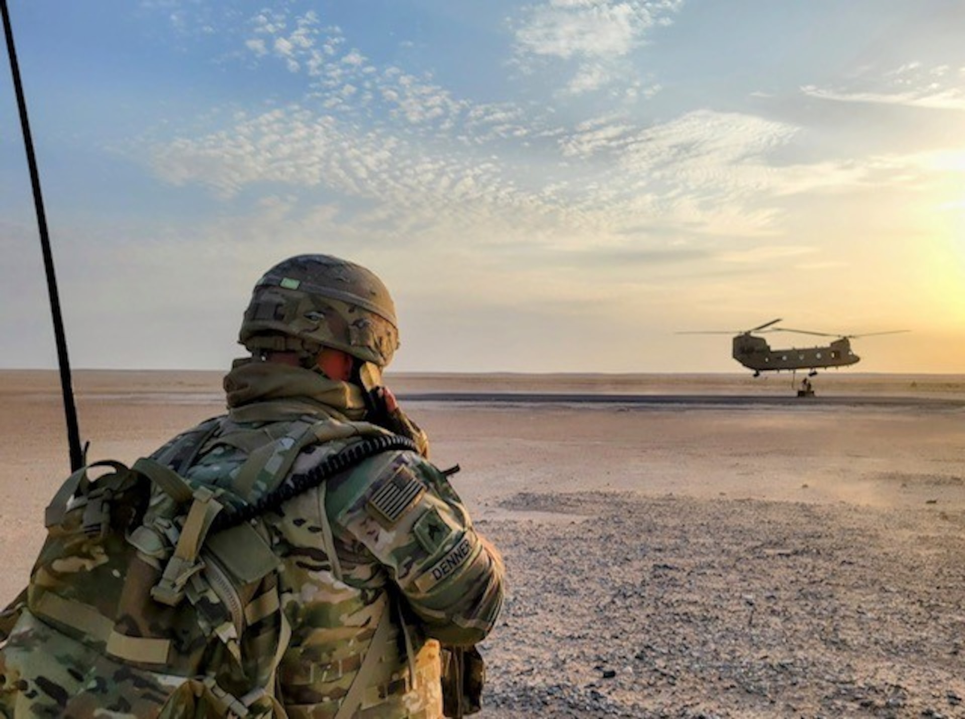 U.S. Army Sgt. Trevor Denner of Alpha Battery, 1st Battalion, 623rd Field Artillery, coordinates a sling load delivery of rockets to a training area at Camp Buehring, Kuwait.