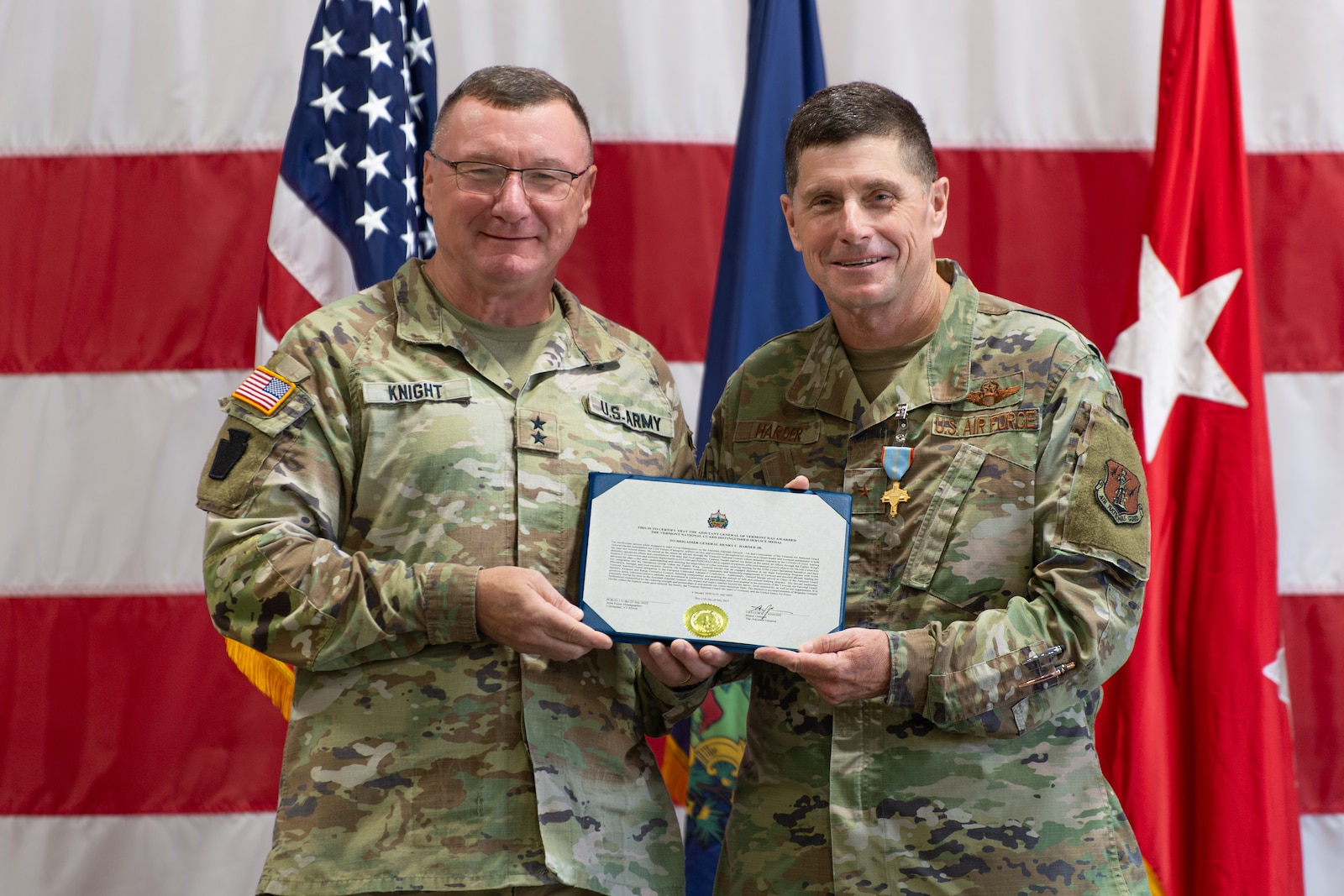 Photo of U.S. Army Maj. Gen. Gregory Knight, the adjutant general of Vermont, presenting the Vermont National Guard Distinguished Service Medal to U.S. Air Force Brig. Gen. Henry Harder, the outgoing commander, at Camp Johnson, Colchester, Vermont, Aug. 1, 2025.