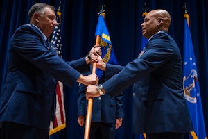 U.S. Air National Guard Colonel Jaison Brown, Commander of the 134th MDG, right, accepts the guidon from Col. Ron Selvidge, commander of the 134th Air Refueling Wing, during a change of command ceremony at McGhee Tyson Air National Guard Base, Louisville, Tenn., on August 2, 2025.