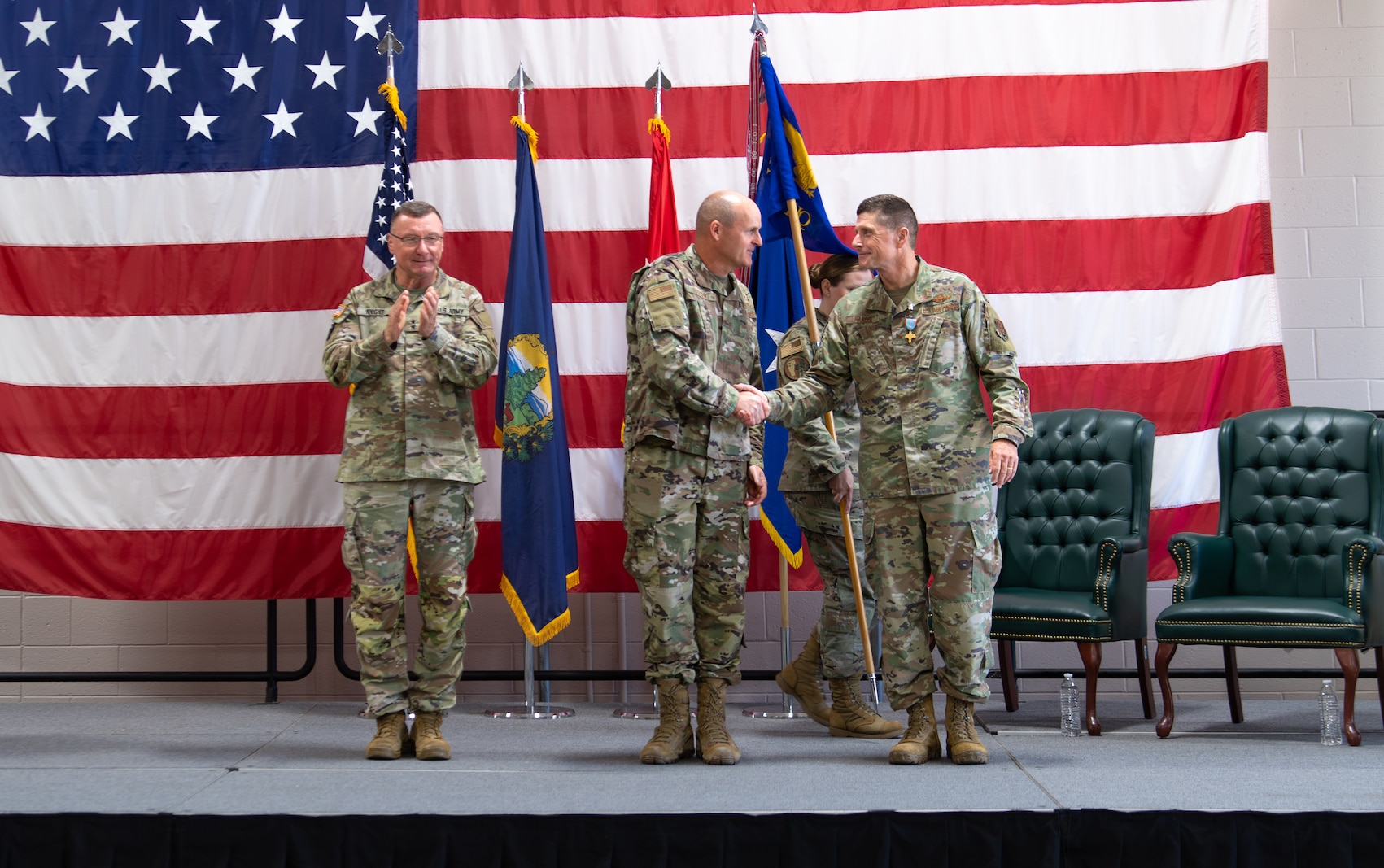 Photo of U.S. Air Force Brig. Gen. David Shevchik Jr., the incoming commander, shaking the hand of U.S. Air Force Brig. Gen. Henry Harder, the outgoing commander, during a change of command ceremony at Camp Johnson, Colchester, Vermont, Aug. 1, 2025.