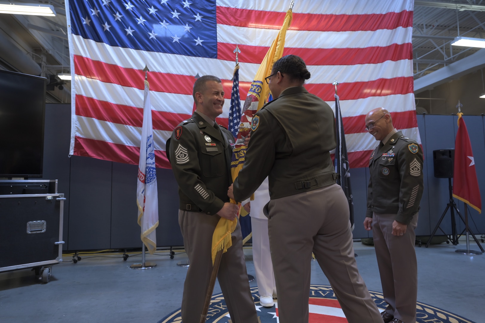 — Joint Task Force – Civil Support (JTF-CS) held a Change of Responsibility ceremony last week to formally transfer the role of Command Senior Enlisted Leader from U.S. Army Command Sgt. Maj. Erano Bumanglag to U.S. Army Command Sgt. Maj. David Silva.
The ceremony, steeped in military tradition, included the symbolic passing of the unit’s colors, a gesture that represents the transfer of authority, trust, and responsibility from one senior enlisted leader to another. Hosted by U.S. Army Brig. Gen. Tanya McGonegal, JTF-CS commander , the event celebrated both the distinguished service of the outgoing senior enlisted leader and the arrival of a new one.