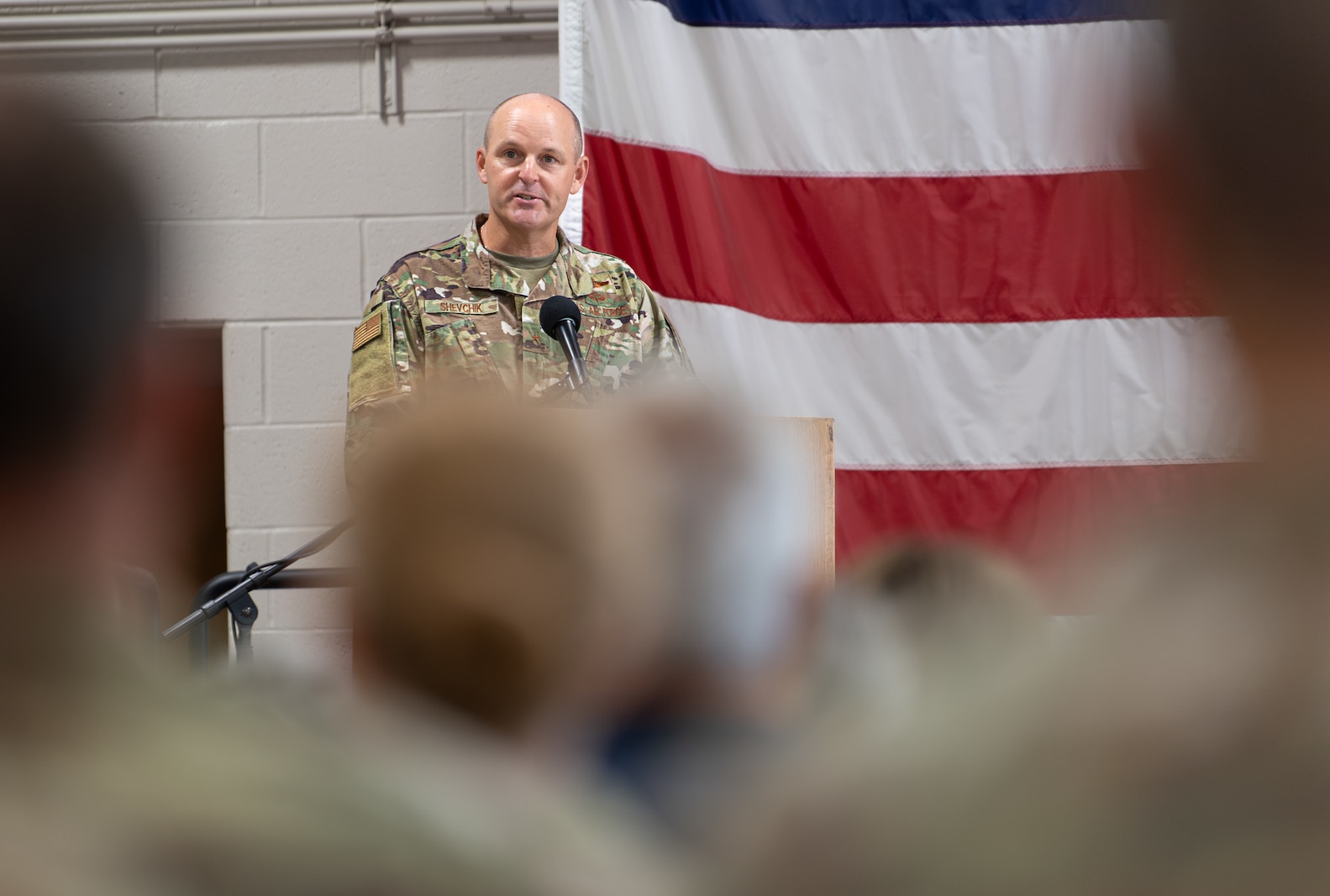 Photo of U.S. Air Force Brig. Gen. David Shevchik Jr., the incoming commander, speaks during a change of command ceremony, at Camp Johnson, Colchester, Vermont, Aug. 1, 2025.