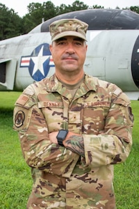 U.S. Air Force Warrant Officer 1 David Denney of the 241st Engineering Installation Squadron, poses in front of a staged aircraft at the National Guard installation in Chattanooga, Tennessee, August 2, 2025.