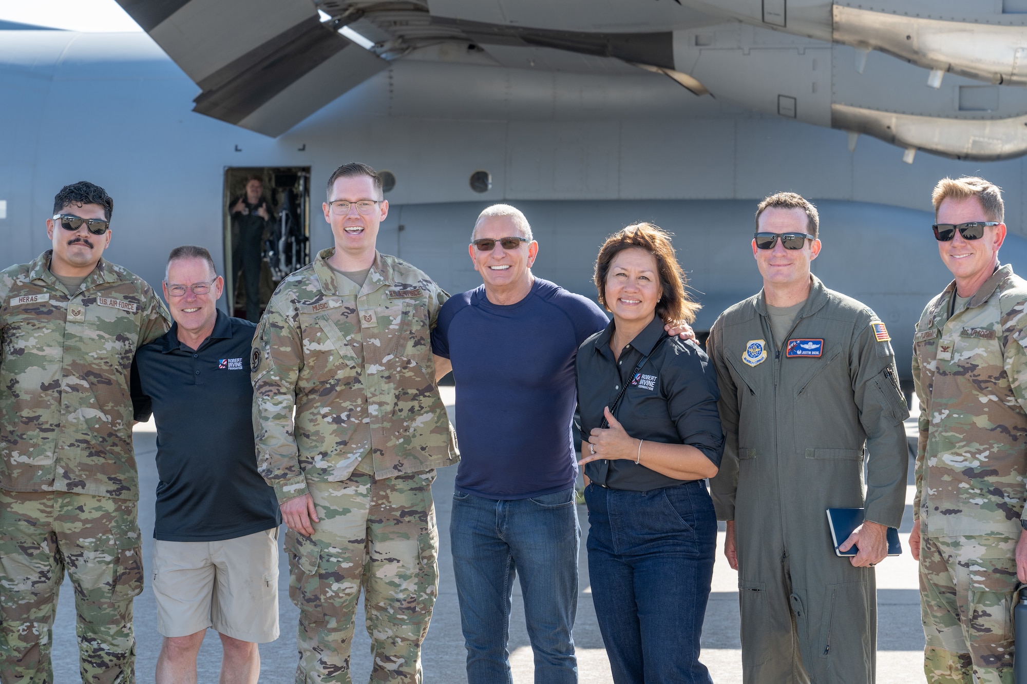 Celebrity Chef Robert Irvine and retired Chief Master Sergeant of the Air Force JoAnne S. Bass, pose for a photo next to a C-130J Super Hercules before the “Breaking Bread with Heroes” event at Dyess Air Force Base, Texas, July 31, 2025. Irvine regularly visits military bases, hosts morale-boosting events, and advocates for greater public awareness of the challenges faced by service members. (U.S. Air Force photo by Airman Caleb Schellenberg)