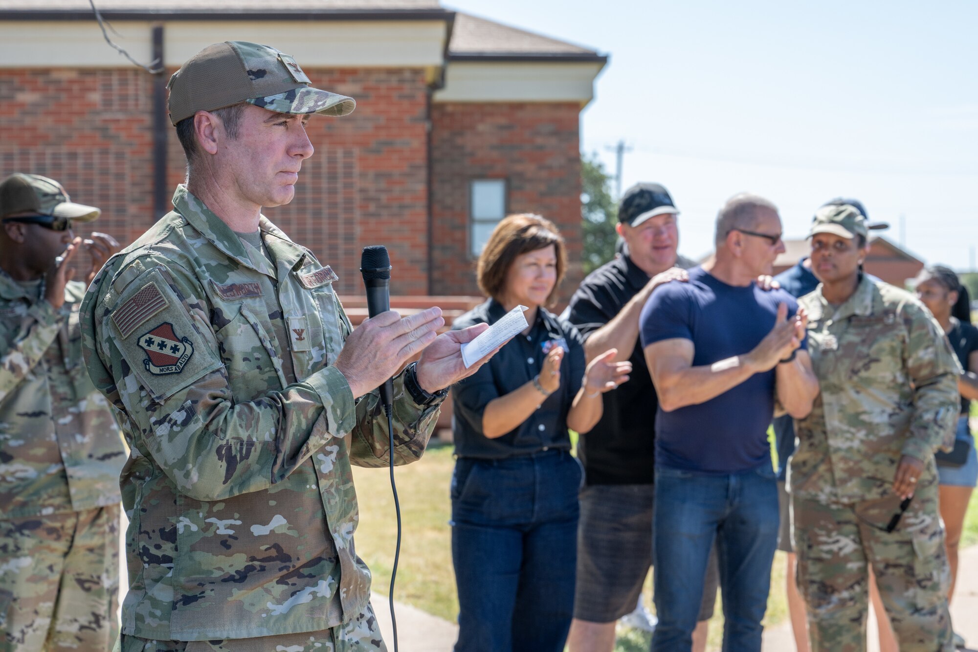 U.S. Air Force Col. Ryan Stallsworth, 7th Bomb Wing deputy commander, delivers opening remarks during the “Breaking Bread with Heroes” event at Dyess Air Force Base, Texas, July 31, 2025. The event was part of the Robert Irvine Foundation’s "Breaking Bread with Heroes" program, which aims to enhance the quality of life for service members through health, fitness, and resiliency initiatives. (U.S. Air Force photo by Airman Caleb Schellenberg)
