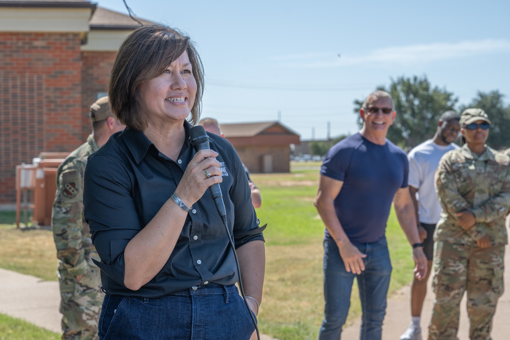 Retired Chief Master Sergeant of the Air Force JoAnne S. Bass delivers remarks during the “Breaking Bread with Heroes” event at Dyess Air Force Base, Texas, July 31, 2025. Bass currently serves on the board of directors for the Robert Irvine Foundation and is an honorary board co-chair for the Women in Military Service for America Foundation. These roles allow her to continue her passion of advocacy for service members and their families. (U.S. Air Force photo by Airman Caleb Schellenberg)
