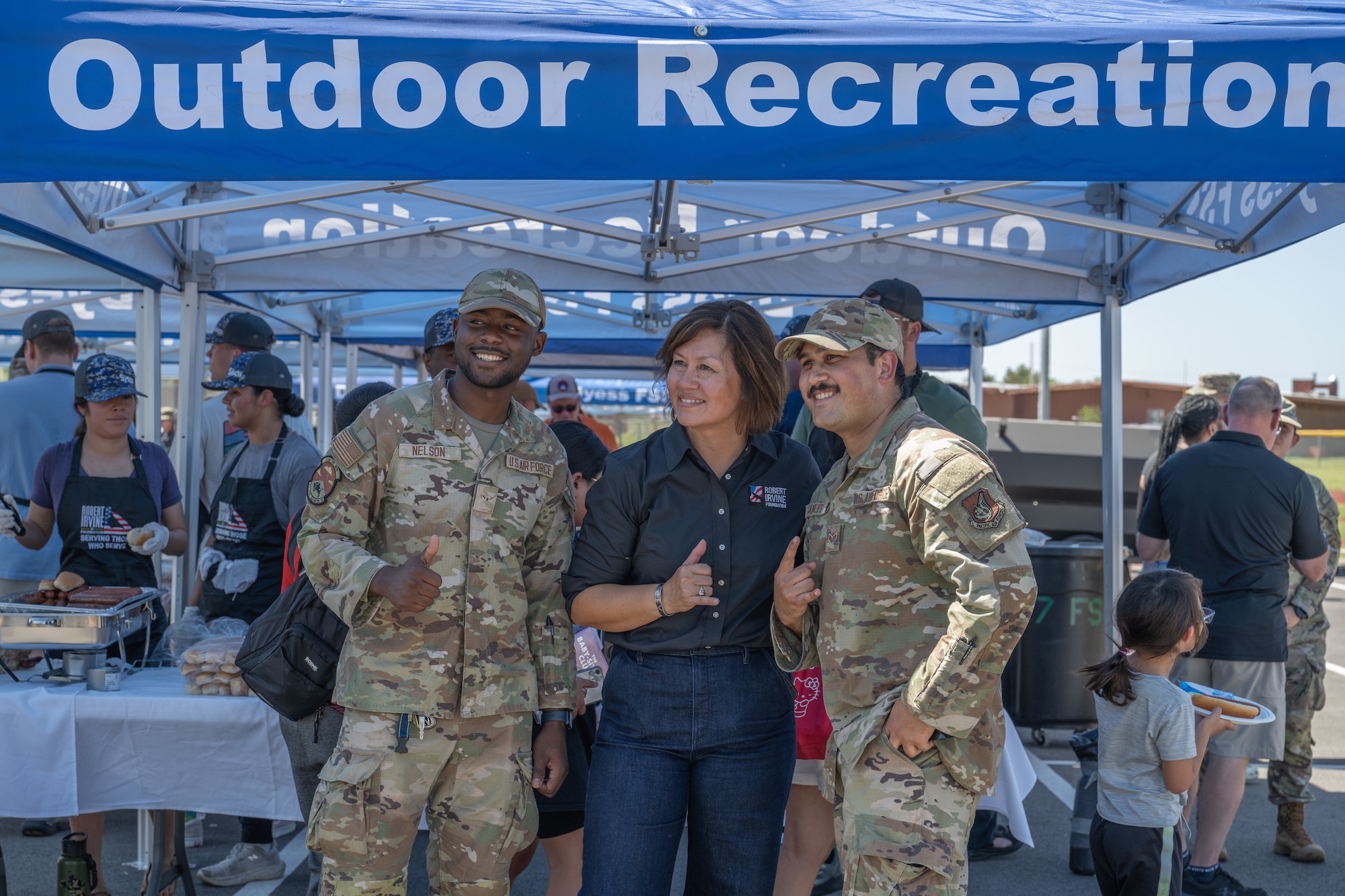 Airmen from Dyess Air Force Base pose for a photo with retired Chief Master Sergeant of the Air Force JoAnne S. Bass during the “Breaking Bread with Heroes” event at Dyess AFB, Texas, July 31, 2025. Since retiring in 2024, Bass has remained a leading advocate for Airmen, championing causes like enlisted morale, readiness, and compensation. (U.S. Air Force photo by Airman Caleb Schellenberg)