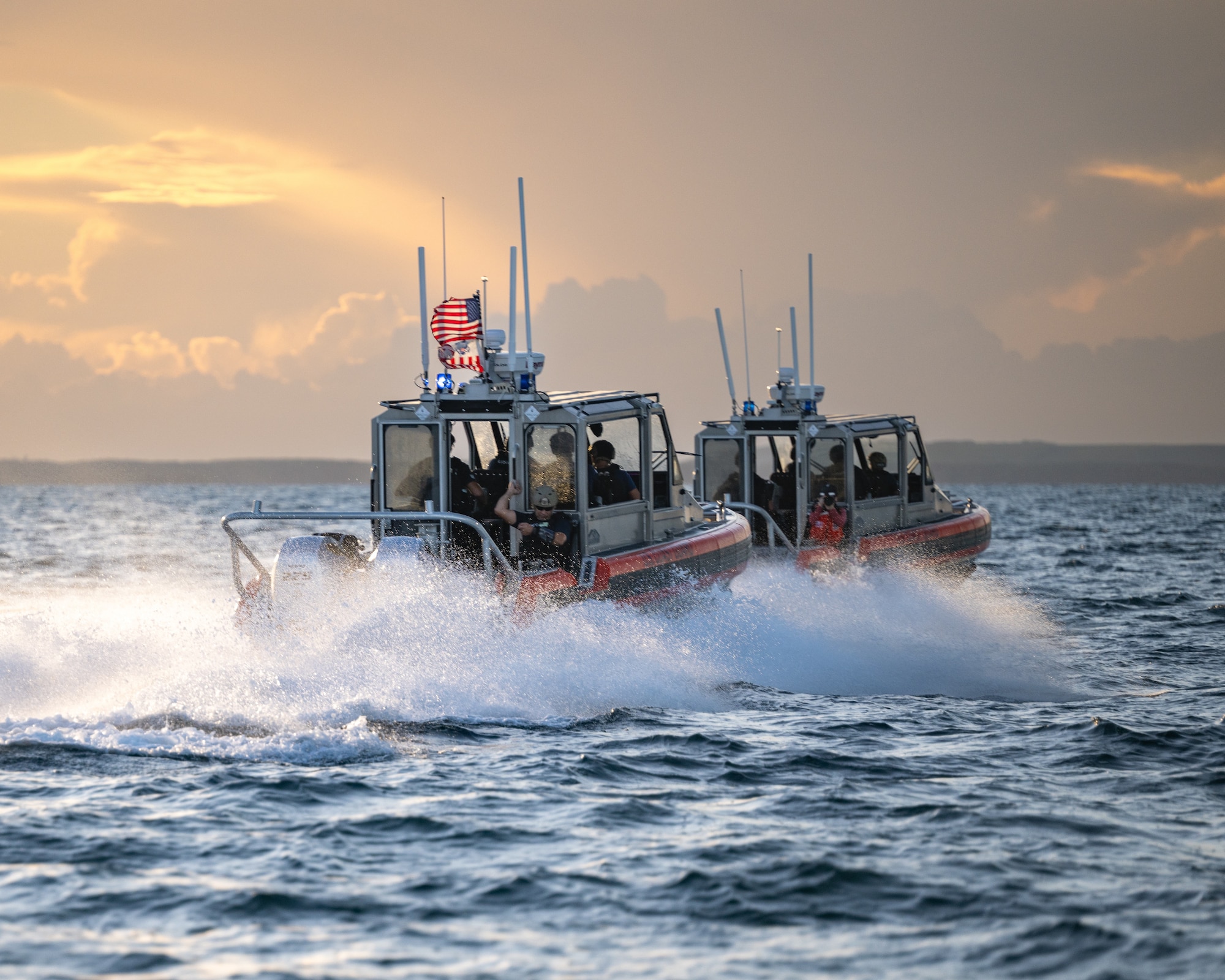 U.S. Coast Guard members with MSST Miami engage in a high-speed tactical maneuver during a Non-Compliant Vessel Pursuit training event in Biscayne Bay, Florida, June 16, 2025