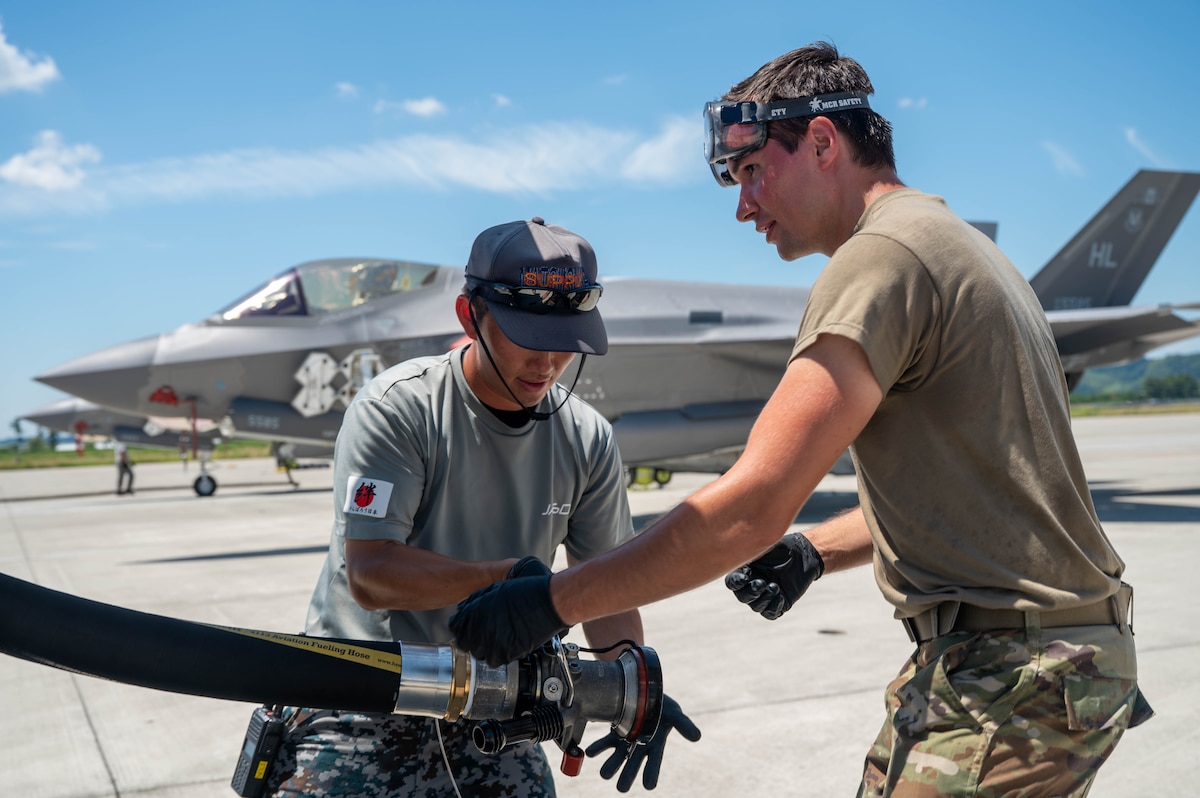 A Japan Air Self-Defense Force airman, assigned to the 4th Air Wing, and a U.S. Air Force Airman, assigned to the 421st Fighter Generation Squadron, refuel 421st Fighter Squadron F-35 Lightning IIs during exercise Resolute Force Pacific 2025 at Matsushima Air Base, Japan, July 25, 2025