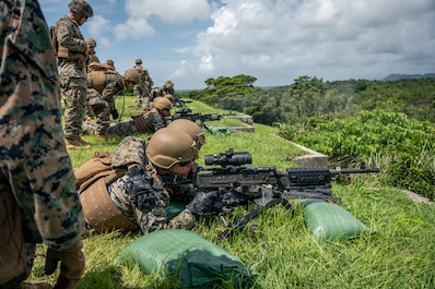 CAMP SCHWAB, Japan (July 30, 2025) — U.S. Marines with Headquarters Company, 4th Marine Regiment fire M240B machine guns during a live-fire range on Camp Schwab, Okinawa, Japan, July 30, 2025. This range allowed Marines to reinforce their machine...