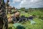 U.S. Marines with Headquarters Company, 4th Marine Regiment fire M240B machine guns during a live-fire range on Camp Schwab, Okinawa, Japan, July 30, 2025.