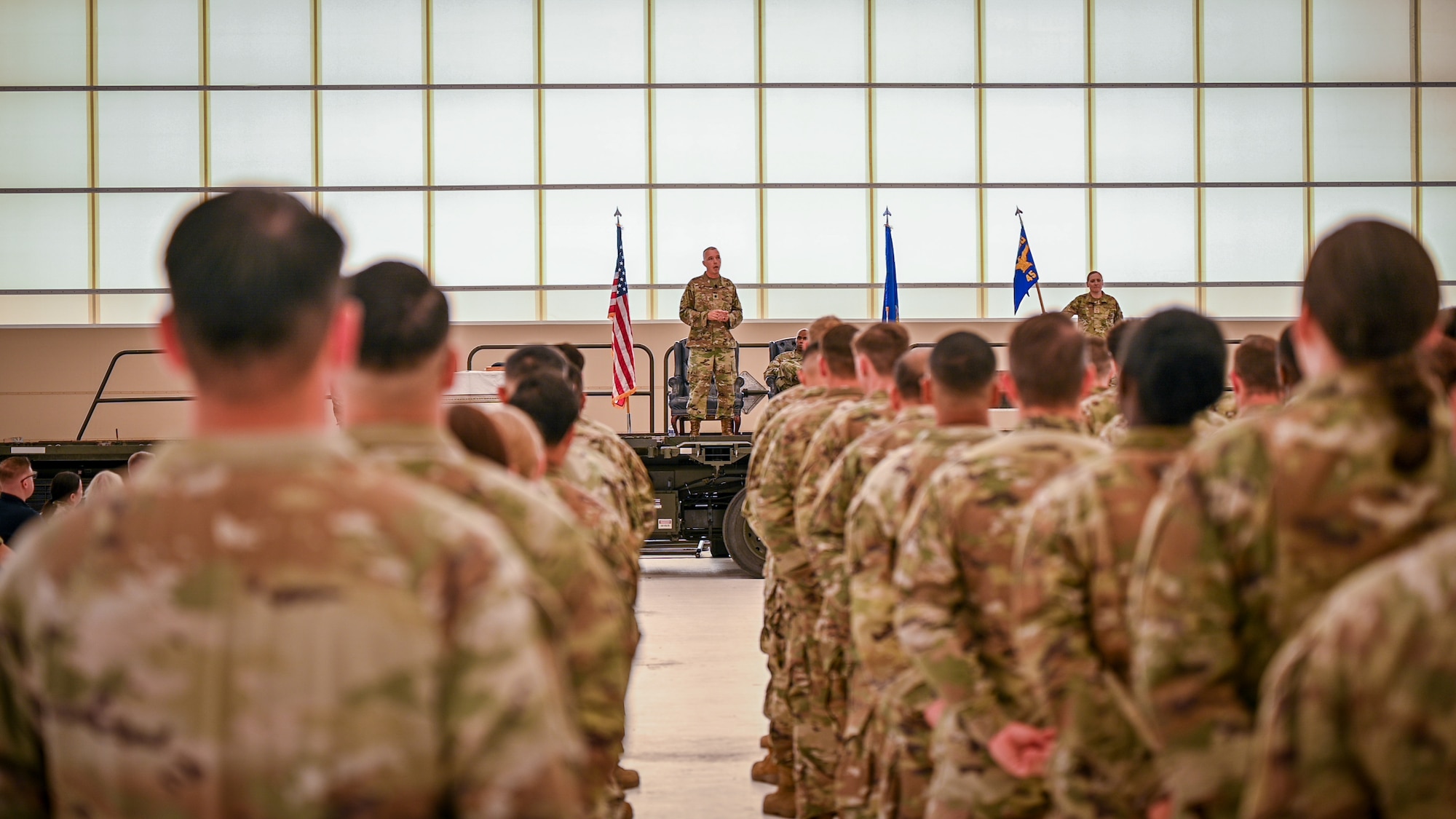 Lt. Col. Dennis Hale, commander of the 349th Mission Support Group and the ceremony’s presiding officer, addresses Airmen of the 45th Aerial Port Squadron from a K-loader used as a stage during the squadron’s inactivation ceremony Aug. 2, 2025, at Travis Air Force Base, California. The ceremony marked the official end of the squadron's 61-year history, with its personnel and mission being reassigned to other units within the 349th Air Mobility Wing.