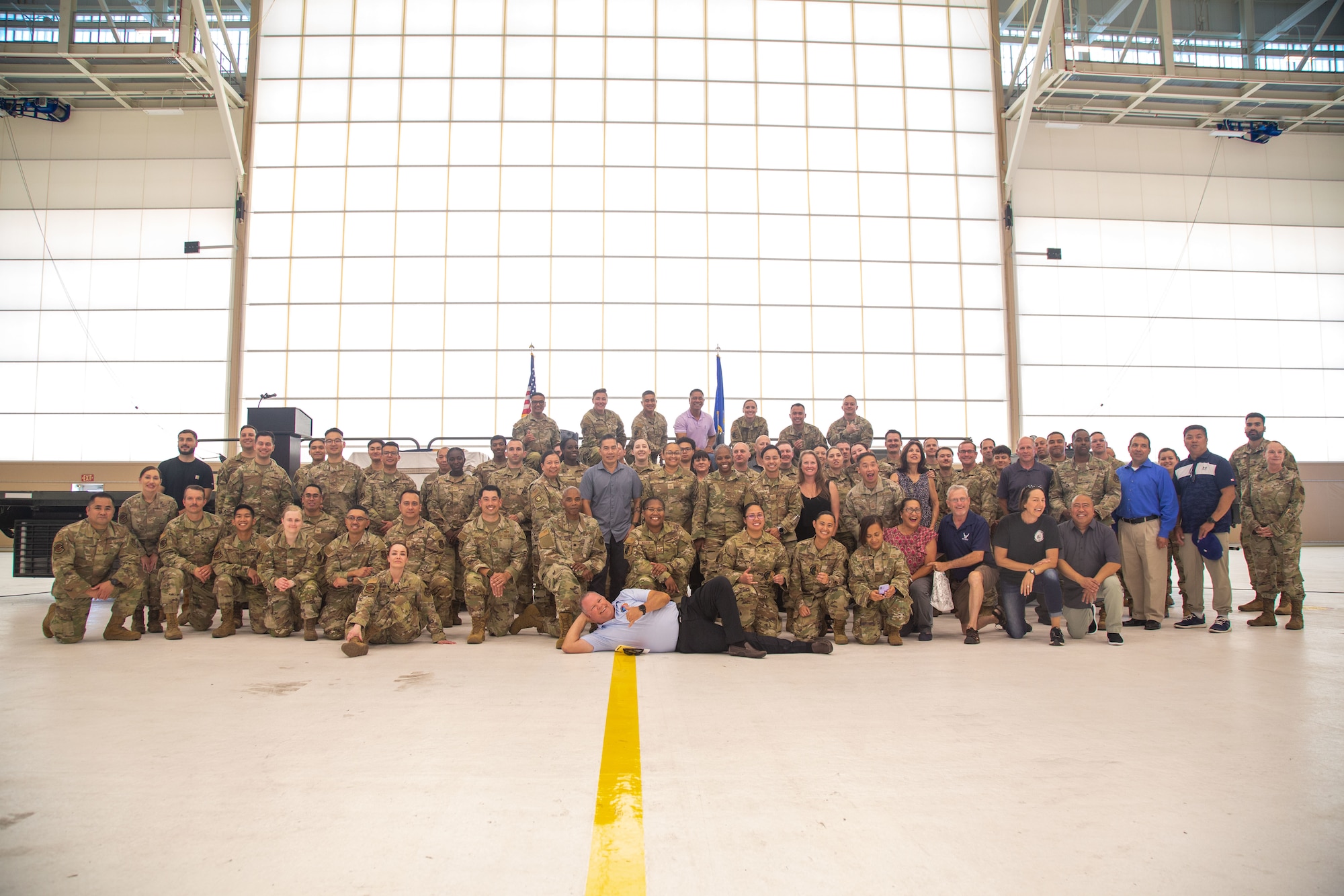 Former 45th Aerial Port Squadron members pose for a group photos after the 45 APS inactivation ceremony at Travis AFB, Calif. on Aug. 2, 2025.