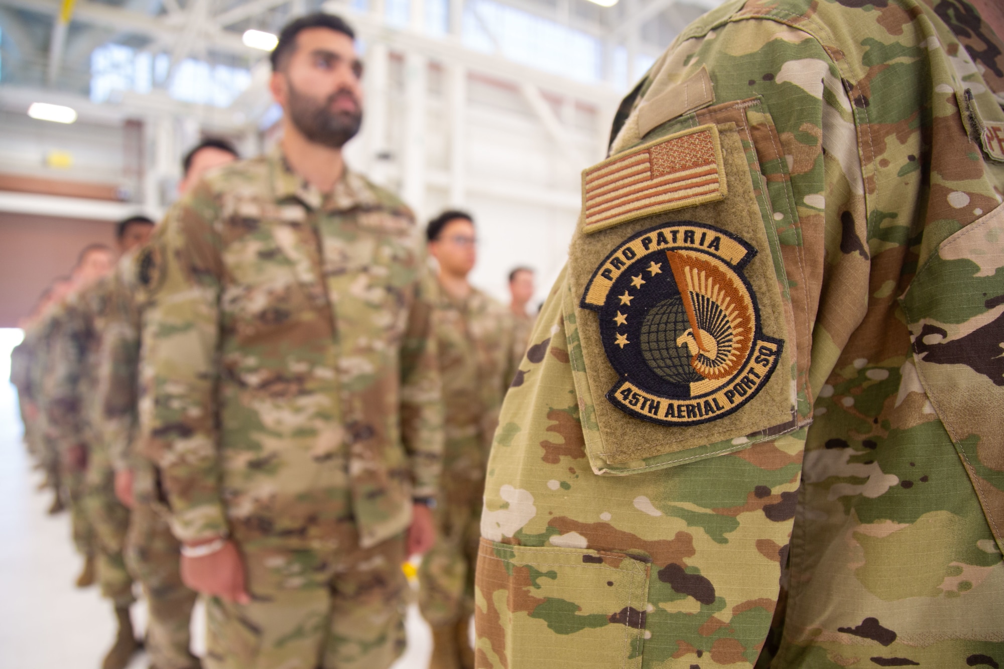 Members of the 45th Aerial Port Squadron stand in formation during their inactivation ceremony at Travis AFB, Calif. on Aug. 2, 2025.