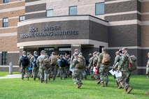 U.S. Airmen from various installations assigned to the 22nd Air Task Force (ATF) arrive at the in-processing auditorium in preparation for Exercise Northern Strike 25-2 (NS 25-2) at Fort Custer, Michigan, Aug. 3, 2025.