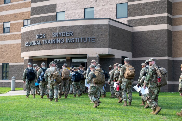U.S. Airmen from various installations assigned to the 22nd Air Task Force (ATF) arrive at the in-processing auditorium in preparation for Exercise Northern Strike 25-2 (NS 25-2) at Fort Custer, Michigan, Aug. 3, 2025.